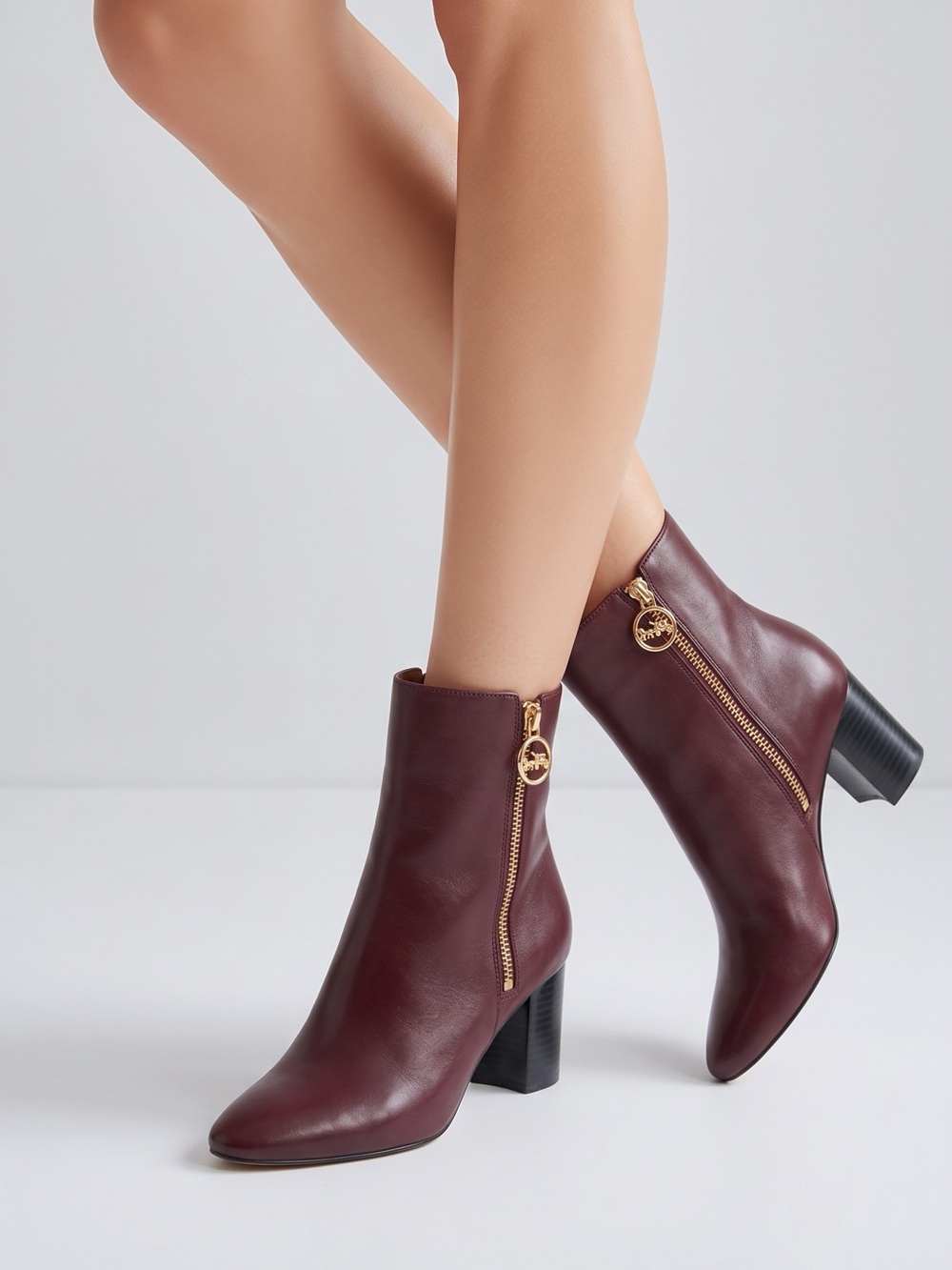 Coach Wine Leather Ankle Boots with Gold Zip Pull